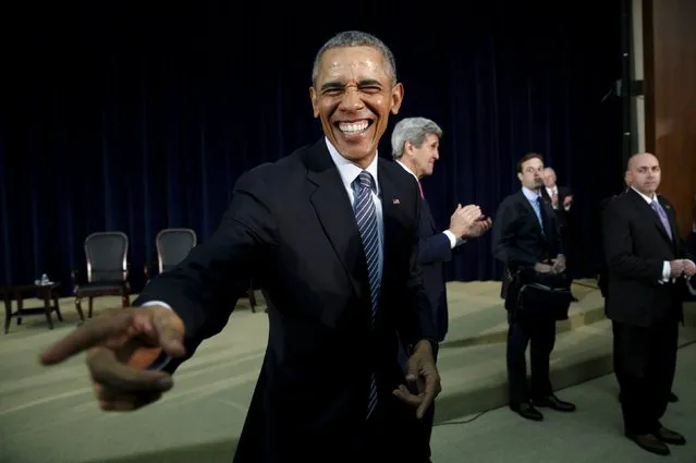 U.S. President Barack Obama reacts while greeting members of the audience after speaking at the Chief of Missions Conference at the State Department in Washington March 14, 2016. Behind Obama applauding is U.S. Secretary of State John Kerry. (Photo by Kevin Lamarque/Reuters)