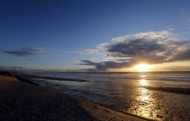 Waves and beach front along the Atlantic Ocean coast are pictured at sunset in Cap Ferret, southwestern France, February 19, 2016. (Photo by Regis Duvignau/Reuters)