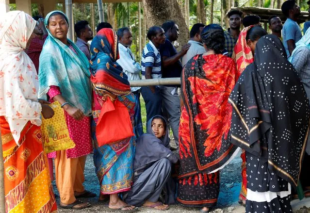 People wait in line to cast their votes at a polling station during the first phase of the general election, in Alipurduar district in the eastern state of West Bengal, India, on April 19, 2024. (Photo by Sahiba Chawdhary/Reuters)