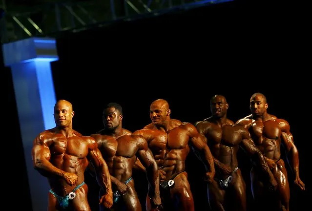 Professional bodybuilders pose during the Arnold Classic Brazil 2015 in Rio de Janeiro, May 30, 2015. REUTERS/Ricardo Moraes