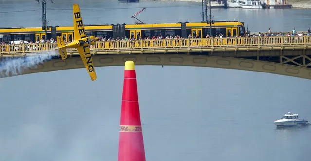 French pilot Francois Le Vot flies with his Edge 540 V2 during the qualifying session of the Red Bull Air Race World Championship in Budapest, Hungary, July 4, 2015. (Photo by Laszlo Balogh/Reuters)