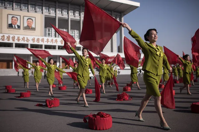 Members of a propaganda troupe perform in a public square in Pyongyang on April 12, 2017. (Photo by Ed Jones/AFP Photo)