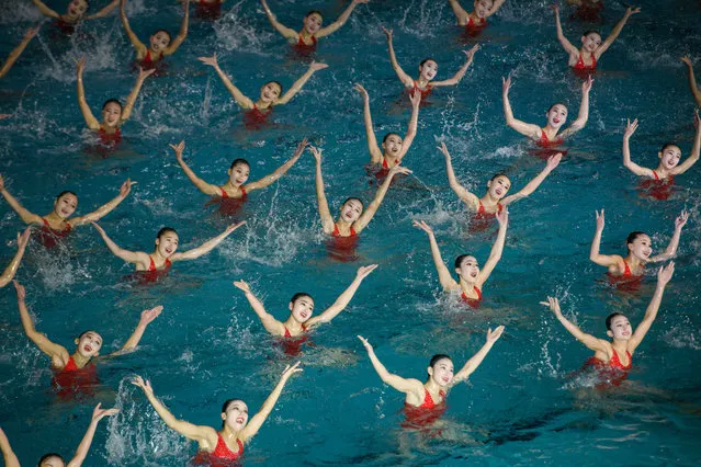 Swimmers perform in a synchronised swimming gala event celebrating late North Korean leader Kim Jong Il, in Pyongyang, North Korea on February 14, 2019. (Photo by Ed Jones/AFP Photo)