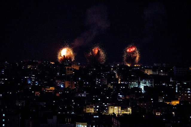 This picture taken early on April 7, 2023 shows explosions in Khan Yunis in the southern Gaza Strip during Israeli air strikes on the Palestinian enclave. (Photo by Yousef Masoud/AFP Photo)