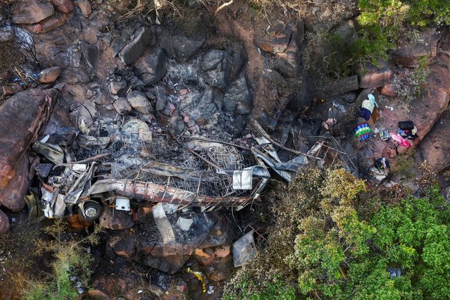 A view of the burnt remains of the bus that was taking Easter pilgrims from Botswana to Moria, following its crash near Mamatlakala in the northern province of Limpopo, South Africa on March 29, 2024. (Photo by Siphiwe Sibeko/Reuters)