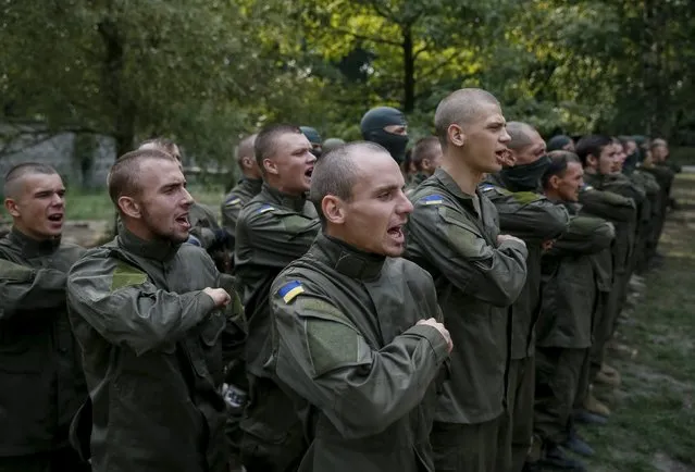 New volunteers for the Ukrainian interior ministry's “Azov” battalion prepare to take part in tests before heading to frontlines in eastern Ukraine, at the battalion's training centre in Kiev, Ukraine, August 14, 2015. (Photo by Gleb Garanich/Reuters)