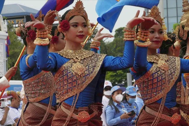 Cambodian dancers perform to mark the 71st founding anniversary of the Cambodian People's Party (CPP) at its headquarters in Phnom Penh, Cambodia, Tuesday, June 28, 2022. (Photo by Heng Sinith/AP Photo)