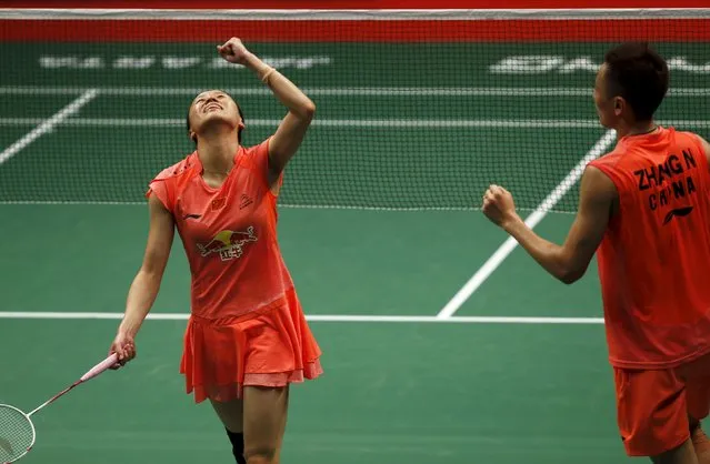 China's Zhao Yunlei and Zhang Nan react after beating compatriots Liu Cheng and Bao Yixin during  their mixed doubles badminton final match at the BWF World Championships in Jakarta, August 16, 2015. (Photo by Reuters/Beawiharta)