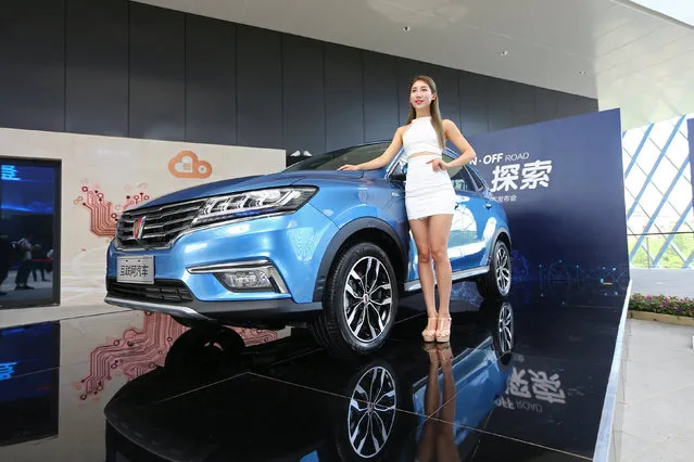 A view of the launch event of Alibaba's internet-connected car in Hangzhou, Zhejiang province, China, July 6, 2016. Chinese tech firm Alibaba's internet-connected car will set the Chinese e-commerce giant up to quickly introduce driverless vehicle technology, Chief Technology Officer Wang Jian told on Wednesday. Alibaba and the country's largest automaker SAIC Motor Corp demonstrated their jointly developed car equipped with the YunOS operating system, which can link up with smart phones, at an event in eastern China's Hangzhou on Wednesday. The car is slated to go on sale later this year. (Photo by Reuters/China Daily)