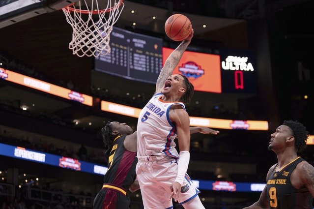 Florida guard Will Richard (5) dunks the ball over Arizona State guard Joson Sanon (3) during the second half of an NCAA college basketball game against Arizona State on Saturday, December 14, 2024, in Atlanta. (Photo by Kathryn Skeean/AP Photo)
