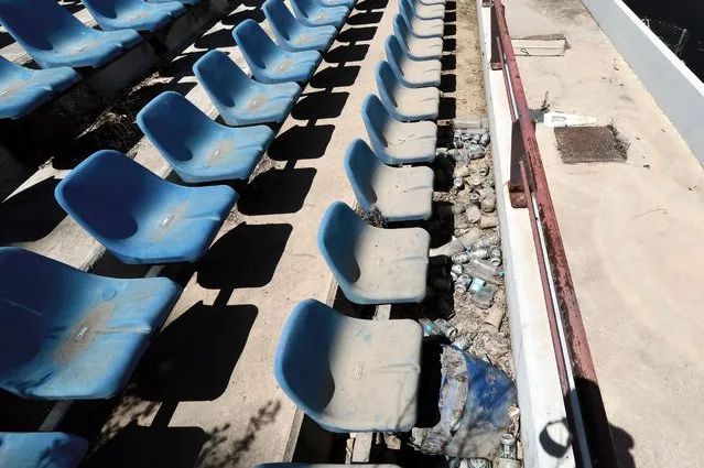 View of derelict stands at the Olympic Baseball Stadium at the Helliniko Olympic complex in Athens, Greece, July 31, 2014. Due to Greece's economic frailties after the Olympic Games, there has been no further investment and the majority of the newly constructed stadiums now lie abandoned. (Photo by Milos Bicanski/Getty Images)
