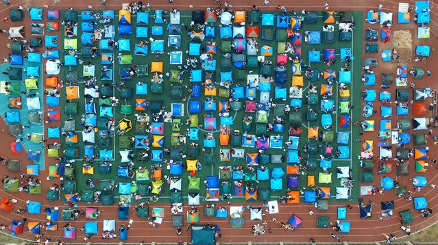 Aerial view of about 300 tents put up by elementary students and their parents on the playground on September 15, 2017 in Shijiazhuang, Hebei Province of China. A primary school in Shijiazhuang held the parent-child activities for their first-year students. (Photo by VCG/VCG via Getty Images)