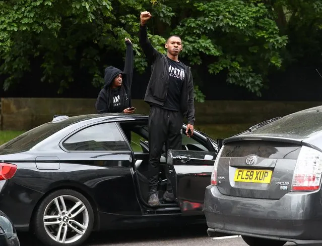 A man reacts from his car in Park Lane during a “Black Lives Matter” protest following the death of George Floyd who died in police custody in Minneapolis, London, Britain, June 3, 2020. (Photo by Hannah McKay/Reuters)