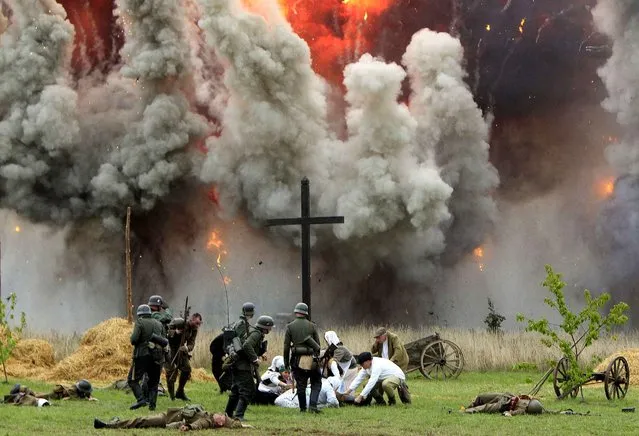 Reconstruction of the battle at the begining of WWII on September 19,1939 in the outskirts of Warsaw between Polish and German armies in Lomianki, Poland, Sunday, September 20, 2015. (Photo by Czarek Sokolowski/AP Photo)