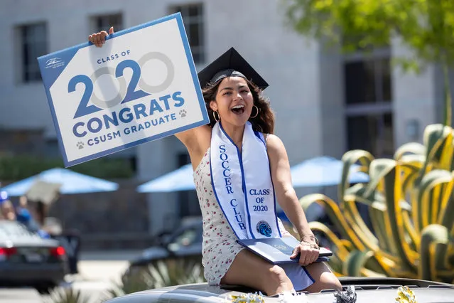 A graduate from California State University San Marcos celebrates while participating in a car parade through campus during the outbreak of the coronavirus disease (COVID-19) in San Marcos, California, U.S., May 15, 2020. (Photo by Mike Blake/Reuters)