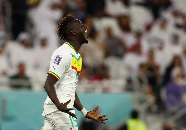 Famara Diedhiou of Senegal team celebrate after score second goal during the FIFA World Cup Qatar 2022 Group A match between Qatar and Senegal at Al Thumama Stadium on November 25, 2022 in Doha, Qatar. (Photo by Kai Pfaffenbach/Reuters)