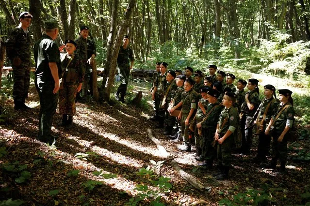 Fifth-grade students of the General Yermolov Cadet School, instructed by tenth-graders and schoolmasters, take part in their first military tactical exercise on the ground, which includes radiation resistance classes, forest survival studies and other activities, in Stavropol, Russia, September 10, 2016. (Photo by Eduard Korniyenko/Reuters)