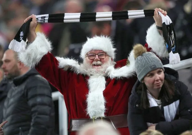 Newcastle United fan dressed as Father Christmas in St James' Park, Newcastle, Britain on December 20, 2022. (Photo by Scott Heppell/Reuters)