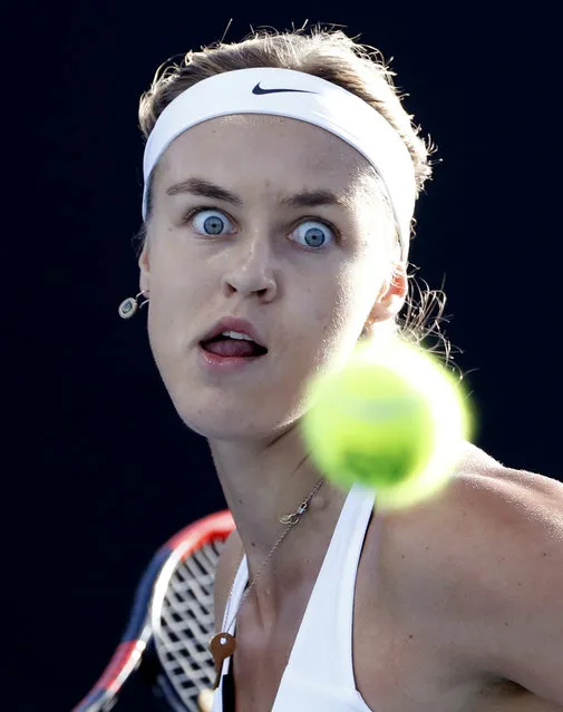 Slovakia's Anna Karolina Schmiedlova eyes on the ball for a return to Russia's Daria Kasatkina during their first round match at the Australian Open tennis championships in Melbourne, Australia, Monday, January 15, 2018. (Photo by Ng Han Guan/AP Photo)