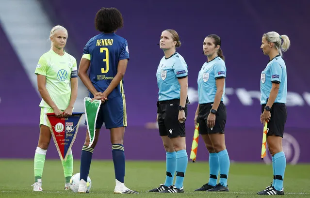 Referee Esther Staubli talks to Lyon's Selma Bacha and Wolfsburg's Pernille Harder, left, before the start of the Women's Champions League final soccer match between Wolfsburg and Lyon at the Anoeta stadium in San Sebastian, Spain, Sunday, August 30, 2020. (Photo by Clive Brunskill/Pool via AP Photo)