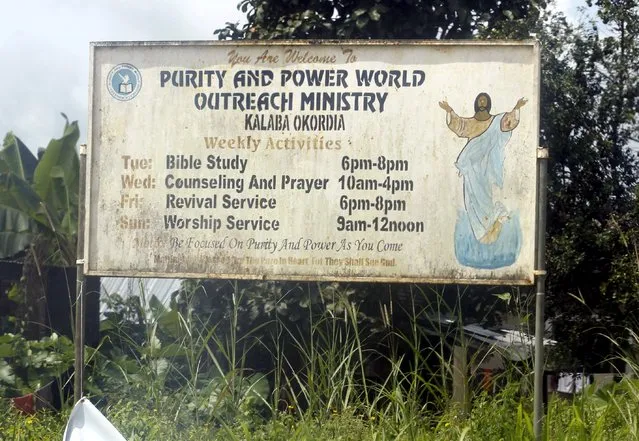 A signboard advertising church service programmes is seen along a road leading to Ikarama village on the outskirt of the Bayelsa state capital, Yenagoa, in Nigeria's delta region October 8, 2015. (Photo by Akintunde Akinleye/Reuters)