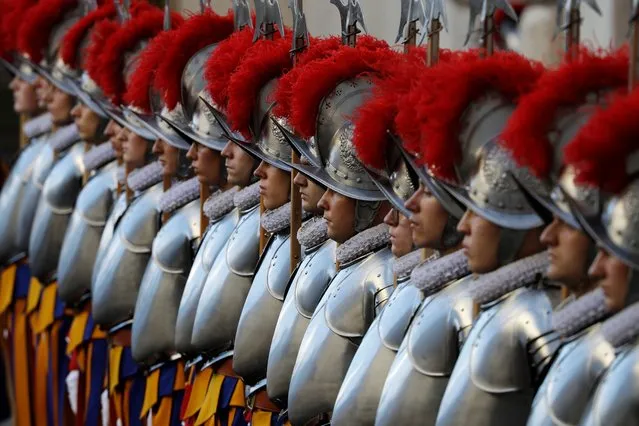 Vatican Swiss Guards stand attention at the St. Damaso courtyard on the occasion of the swearing-in ceremony at the Vatican, Sunday, October 4, 2020. The ceremony is held to commemorate the day in 1527 when 147 Swiss Guards died protecting Pope Clement VII during the Sack of Rome. (Photo by Gregorio Borgia/AP Photo)