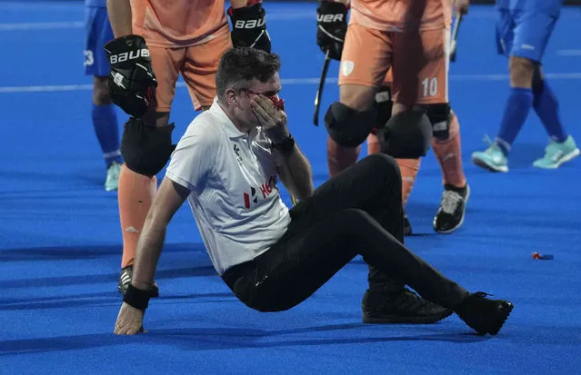 Umpire Ben Goentgen reacts after he was hit on the face off a penalty corner strike during the FIH Men's Hockey World Cup quarterfinal match between Netherlands and Korea at the Kalinga Stadium in Bhubaneswar, India, Wednesday, January 25, 2023. (Photo by Rafiq Maqbool/AP Photo)