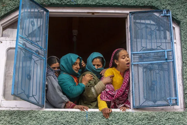 Relatives of Fida Hussain, a leader of India's ruling Bharatiya Janata Party (BJP), mourn during his funeral in Qazigund, south of Srinagar, Indian controlled Kashmir, Friday, October 30, 2020. Assailants shot and killed three BJP politicians in Kashmir late Thursday, police said, blaming militants fighting against Indian rule in the disputed region. Militants fired at the three members of Prime Minister Narendra Modi’s party in southern Kulgam district, police said in a statement. (Photo by Dar Yasin/AP Photo)