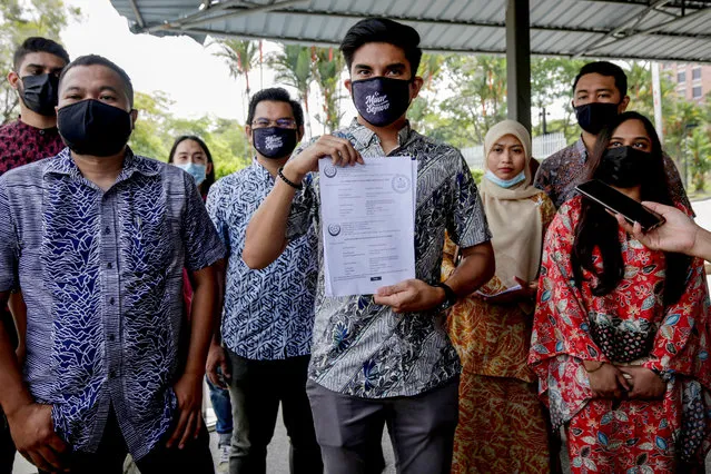 Ousted Parti Pribumi Bersatu Malaysia Youth chief, Syed Saddiq Abdul Rahman (C) shows a document of a new party, Malaysian United Democratic Alliance (Muda) outside the Registrar of Societies (RoS) in Putrajaya, Malaysia, 17 September 2020. Syed Saddiq, 27, says Muda will be the first political party led by young people, multiracial and multireligous that will fight for the young and old. (Photo by Ahmad Yusni/EPA/EFE/Rex Features/Shutterstock)