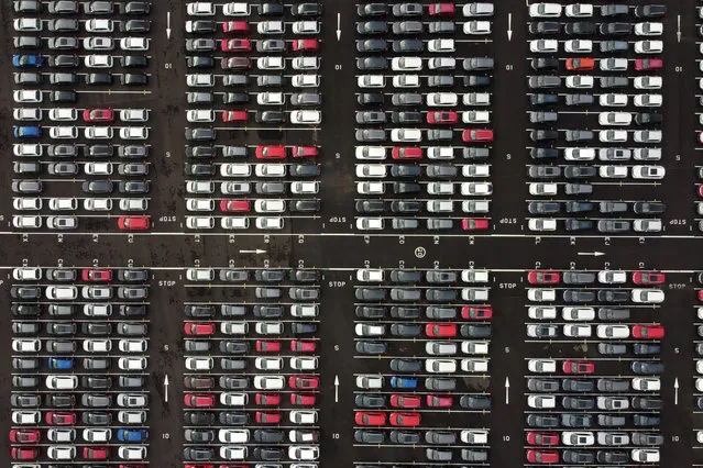 An aerial view shows Lines of new Honda cars parked up at the Royal Portbury Dock in Avonmouth, near Bristol in south-west England on December 4, 2020. In the absence of a Brexit deal, the UK and the EU would move from almost seamless trade in many areas to trading on standard terms set by the World Trade Organization. This could see European tariffs of 37.5% imposed on UK exports of dairy products to the continent, 11.5% on clothes, 22% on vans and trucks and 10% on cars. (Photo by Ben Stansall/AFP Photo)