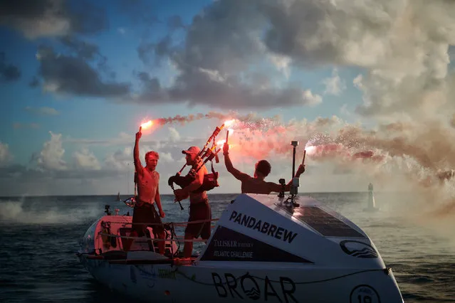 (L-R) Lachlan, Jamie, and Ewan celebrate their arrival in Antigua on January 17, 2020. Brothers Jamie,26, Ewan, 27, and Lachlan, 21, MacLean have become the fastest and youngest trio to row across the Atlantic – from La Gomera in Spain to Antigua in the Caribbean in just 35 days nine hours and nine minutes – being the previous record by six days. (Photo by Ben Duffy Photography/PA Wire Press Association)