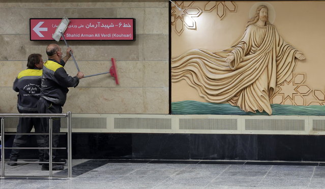 Iranian workers clean inside the Holy Virgin Mary subway station during its opening ceremony in Tehran, Iran, 18 October 2025.  Iran has opened the new Holy Virgin Mary station next to the Saint Sarkis Armenian Apostolic Cathedral in the capital. (Photo by Abedin Taherkenareh/EPA)