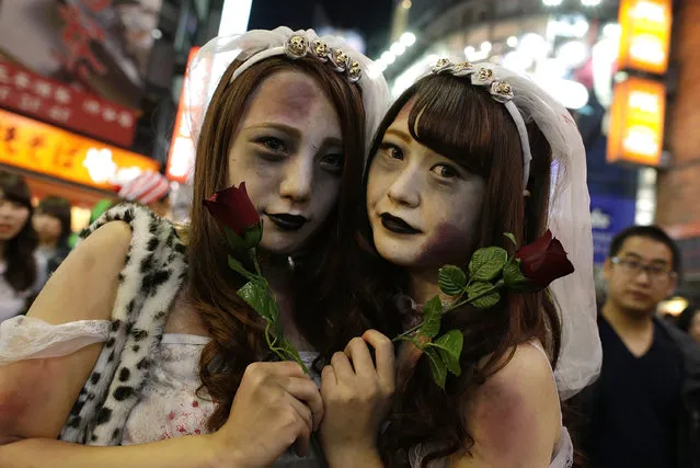 Participants in costume pose for a photograph during Halloween celebration at Shibuya district on October 31, 2016 in Tokyo, Japan. (Photo by Yuya Shino/Getty Images)