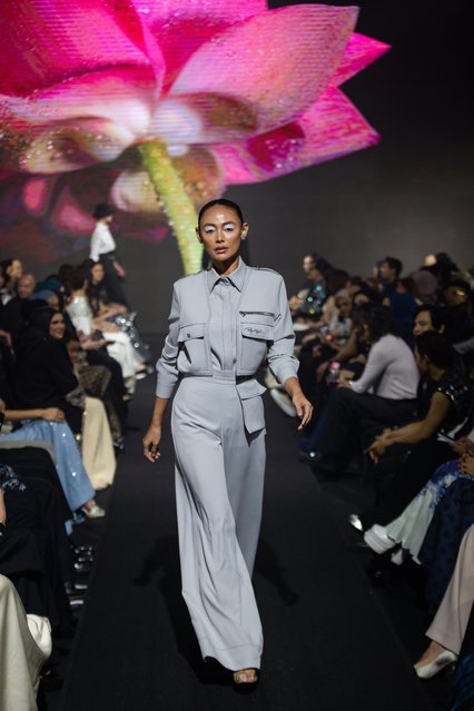 A model walks the runway during the Rizman Ruzaini show at Kuala Lumpur Fashion Week 2025 on August 04, 2025 in Kuala Lumpur, Malaysia. The Rizman Ruzaini show marked the brand's 20th anniversary, celebrating two decades of couture with archival reinterpretations and a tribute to Malaysian fashion. Kuala Lumpur Fashion Week 2025 gathered leading designers from across the region, spotlighting contemporary Southeast Asian fashion. (Photo by Annice Lyn/Getty Images)