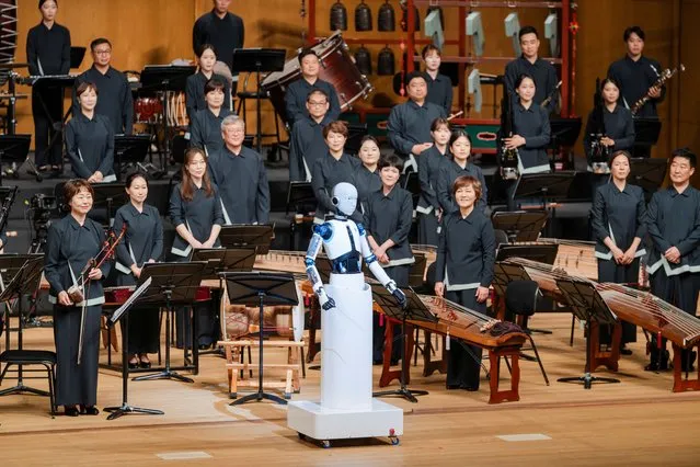 An android robot, EveR 6, is seen as it takes the conductor's podium to lead a performance by South Korea's national orchestra, in Seoul, South Korea on June 30, 2023, in this handout picture. (Photo by National Theater of Korea/Handout via Reuters)