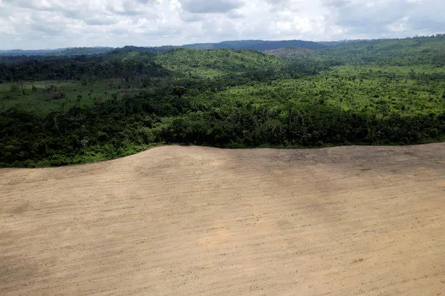 An aerial view of cleared land is seen during an operation to combat illegal mining and logging conducted by agents of the Brazilian Institute for the Environment and Renewable Natural Resources, or Ibama, supported by military police, in the municipality of Novo Progresso, Para State, northern Brazil, November 11, 2016. (Photo by Ueslei Marcelino/Reuters)