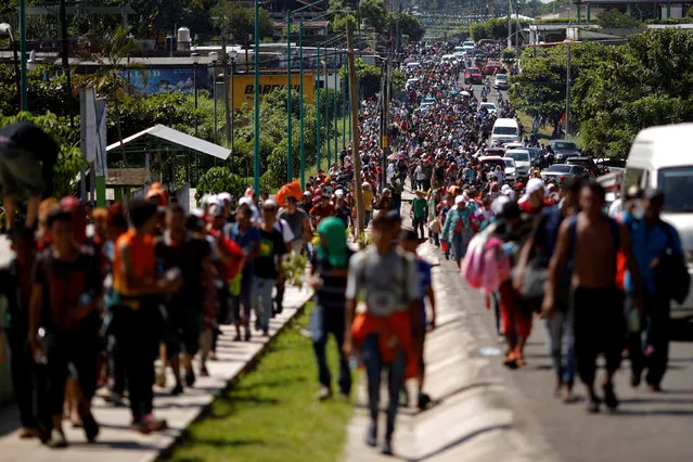 Central American migrants walk along the highway near the border with Guatemala, as they continue their journey trying to reach the U.S., in Tapachula, Mexico October 21, 2018. (Photo by Ueslei Marcelino/Reuters)