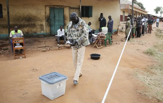 A man casts his ballot in a polling station during elections in Kaabong in Karamoja region, Uganda February 18, 2016. (Photo by Goran Tomasevic/Reuters)