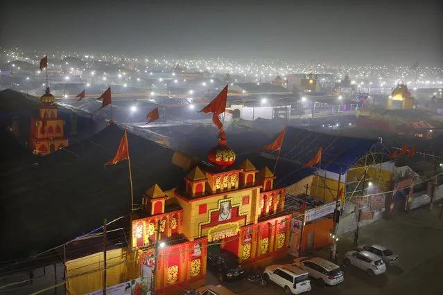 In this Monday, January 14, 2019, photo, a thick layer of dust is seen over the tent city set up for the spiritual-cleansing Kumbh Festival in Prayagraj, India. The skies over the confluence of sacred rivers in north India where millions of Hindu priests and pilgrims have come to wash away their sins for the Kumbh Mela, or pitcher festival, that begins this week are thick with toxic dust, a sign that Indian government officials are struggling to grapple with India's worsening air pollution. (Photo by Rajesh Kumar Singh/AP Photo)
