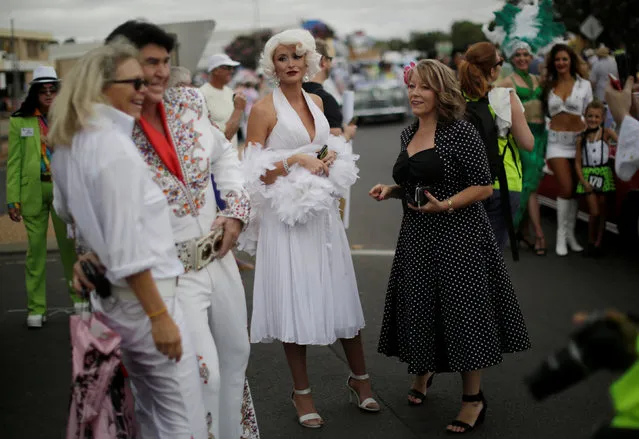 A Marilyn Monroe look-alike prepares to participate in a street parade at honouring Elvis Presley at the the 25th annual Parkes Elvis Festival in the rural Australian town of Parkes, west of Sydney, January 14, 2017. (Photo by Jason Reed/Reuters)