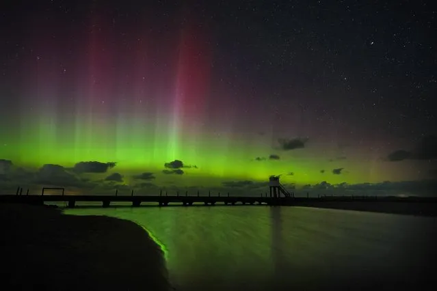 A stunning show of the Northern lights over the refuge hut on the Holy Island causeway in Northumberland on Wednesday, September 13, 2023. (Photo by Owen Humphreys/PA Images via Getty Images)