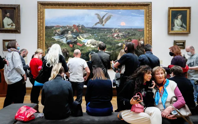 Visitors at a preview of an exhibition titled “Rejected Masterpieces: Pavel Tretyakov's Challenge” at Tretyakov Gallery in Moscow, Russia on September 15, 2021. The exhibition features a selection of artworks of the second half of the nineteenth century that stimulated debate and controversy. (Photo by Gavriil Grigorov/TASS)