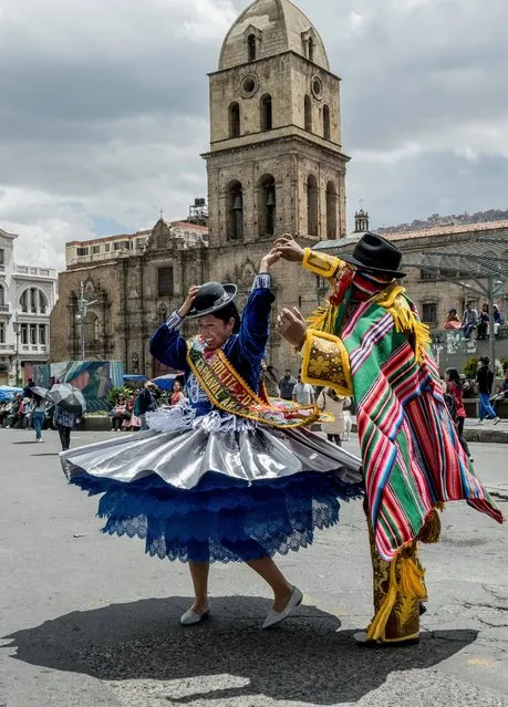 Members of a traditional Bolivian dance group perform during a pre-carnival parade prior to the Jisk'a Anata Carnival, in the streets of La Paz, Bolivia, 28 January 2024. The Jisk'a Anata pre-Carnival is a colorful celebration full of harlequins and cholitas that takes place before the February Carnival. (Photo by Esteban Biba/EPA)