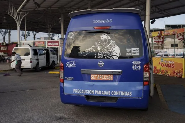 Passenger vans are parked at a station in Tapachula, Mexico, Thursday, January 19, 2023. As Central American street gangs have moved operations into southern Mexico, drivers of the passenger vans and taxis have raised the alarm, holding temporary work stoppages to get authorities’ attention. (Photo by Moises Castillo/AP Photo)