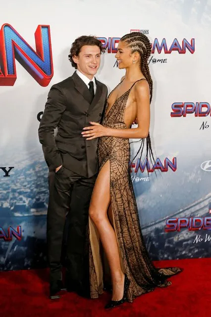 Cast members Tom Holland and Zendaya attend the premiere for the film Spider-Man: No Way Home in Los Angeles, California, December 13, 2021. (Photo by Mario Anzuoni/Reuters)