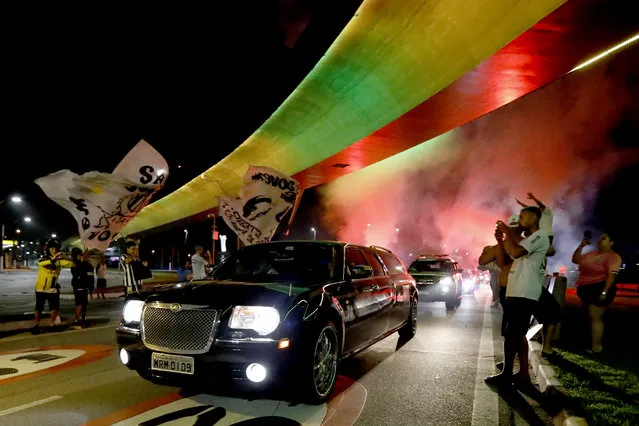 The hearse carrying Pele's coffin arrives to Santos as a firework goes off in the early morning ahead of the football legend's funeral in the stadium on January 02, 2023 in Santos, Brazil. Brazilian football icon Edson Arantes do Nascimento, better known as Pele, died on December 29, 2022 aged 82 after a battle with cancer in Sao Paulo, Brazil. The three-time World Cup champion with Brazil is considered one of the greatest football legends of all time. (Photo by Ricardo Moreira/Getty Images)
