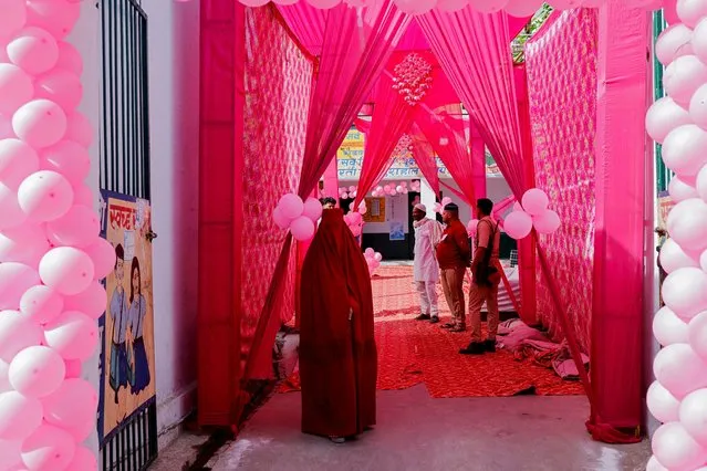 A burqa-clad woman stands at a pink voting booth during the first phase of the general election in Kairana, in the northern Indian state of Uttar Pradesh, India, on April 19, 2024. (Photo by Anushree Fadnavis/Reuters)