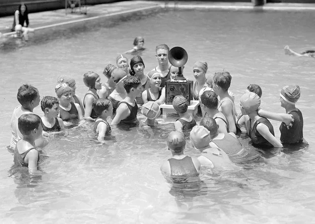 Radio with Speaker Plays in the Middle of a children's swimming Pool, circa 1924  (Photo by Buyenlarge/Getty Images)