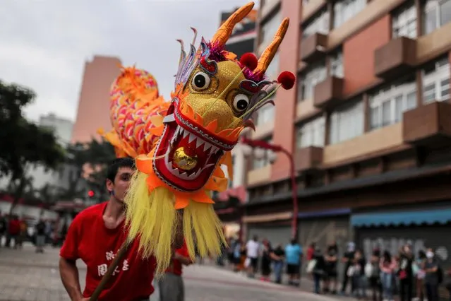 A fire dragon dance is performed during Chinese Lunar New Year celebrations in Sao Paulo, Brazil on February 12, 2021. (Photo by Amanda Perobelli/Reuters)