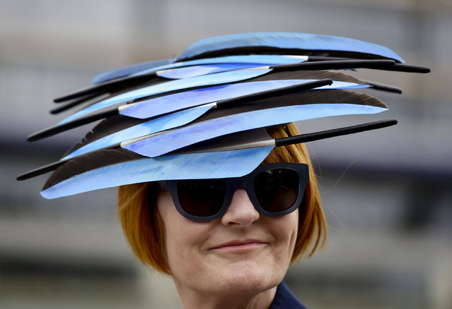 Horse Racing - Royal Ascot - Ascot Racecourse - 17/6/15
A racegoer poses with her hat as she attends the second day of racing 
Reuters / Toby Melville
Livepic
